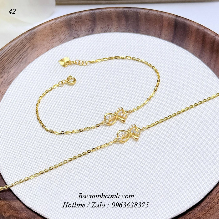 Lắc tay nơ thắt đá giữa vàng 10k LTNU451